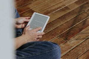 Person reading technology news on a tablet